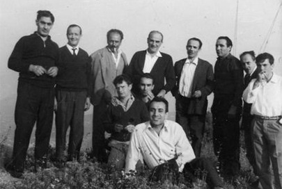 Vintage black-and-white photo: a group of men posing outdoors